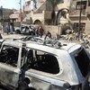 عشرات القتلى والجرحى في انفجار 12 سيارة ملغومة في بغداد 